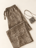 Make a statement while staying comfortable in our Relaxed-Fit Leopard-Print Drawstring Sweatpants, featuring a laid-back fit and adjustable drawstring waist. Perfect for cozy days or casual streetwear looks—shop now and add a bold touch to your wardrobe!