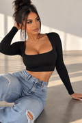 A chic everyday essential featuring a flattering square neckline and sleek long sleeves. Easy to style with jeans, trousers, skirts, or layered under a jacket for a polished look.